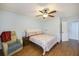 Bright bedroom featuring hardwood floors, ceiling fan, and neutral paint at 14 Newark Ave, Goose Creek, SC 29445