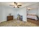 Open room with herringbone floors leading to bedroom with floral bedding and light blue walls at 14 Newark Ave, Goose Creek, SC 29445