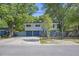 Charming two-story home features a two-car garage and mature trees at 14 Newark Ave, Goose Creek, SC 29445