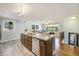 Open kitchen boasts granite countertops, stainless appliances, and connects to living space at 14 Newark Ave, Goose Creek, SC 29445