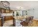 Open kitchen boasts granite countertops, stainless appliances, and a breakfast bar at 14 Newark Ave, Goose Creek, SC 29445