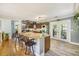 Open kitchen boasts granite countertops, stainless appliances, and a breakfast bar at 14 Newark Ave, Goose Creek, SC 29445