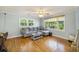 Inviting living room with hardwood floors, plush seating, and lots of natural light at 14 Newark Ave, Goose Creek, SC 29445