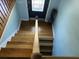 Staircase with hardwood floors leading up to the second story of the home at 14 Newark Ave, Goose Creek, SC 29445