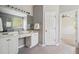 Bright bathroom with double vanity, large mirror, and tiled floor at 1409 Endicot Way, Mount Pleasant, SC 29466