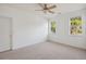 View of a carpeted bedroom with two windows and a ceiling fan at 1409 Endicot Way, Mount Pleasant, SC 29466