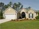 Charming single-story home with a well-manicured lawn, two-car garage, and beautiful landscaping at 1409 Endicot Way, Mount Pleasant, SC 29466