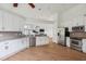 Bright and airy kitchen with stainless steel appliances, granite countertops, and wood floors at 1409 Endicot Way, Mount Pleasant, SC 29466