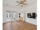 Living room with access to backyard through French doors, a ceiling fan, and wood flooring at 1409 Endicot Way, Mount Pleasant, SC 29466