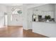 Sun-filled living space featuring a clear view of the kitchen, double doors, and high ceilings at 1409 Endicot Way, Mount Pleasant, SC 29466