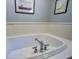 Bathroom with bathtub with tiled trim, chrome faucet, and crisp white paint at 1417 Pine Island View, Mount Pleasant, SC 29464