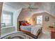 Attic bedroom with a sloped ceiling, hardwood floors, and windows that provide ample natural light at 1417 Pine Island View, Mount Pleasant, SC 29464
