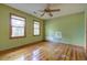 Bright bedroom with hardwood floors and two windows offering natural light at 1417 Pine Island View, Mount Pleasant, SC 29464
