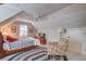 Attic bedroom with vaulted, beadboard ceiling, neutral walls, an accent chair, and a patterned rug at 1417 Pine Island View, Mount Pleasant, SC 29464