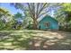 Charming home exterior featuring green siding and a well-maintained lawn, showcasing its inviting curb appeal at 1417 Pine Island View, Mount Pleasant, SC 29464
