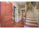 Inviting foyer features hardwood floors, staircase, and views into other rooms at 1417 Pine Island View, Mount Pleasant, SC 29464