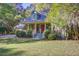 Lovely two-story home with a covered porch and mature trees in the front yard at 1417 Pine Island View, Mount Pleasant, SC 29464
