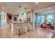 Bright kitchen with bar stool seating and adjacent Gathering room at 1417 Pine Island View, Mount Pleasant, SC 29464