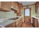 Charming kitchen boasts wooden cabinets, modern appliances, and a door to the outside at 1417 Pine Island View, Mount Pleasant, SC 29464