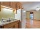Kitchen features a double sink and refrigerator, connecting to a spacious living area with hardwood floors at 1417 Pine Island View, Mount Pleasant, SC 29464
