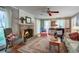Cozy living room featuring a brick fireplace, hardwood floors, and natural light at 1417 Pine Island View, Mount Pleasant, SC 29464