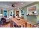 Open-concept living and dining area with wood floors, ceiling fan, and seamless flow to the kitchen at 1417 Pine Island View, Mount Pleasant, SC 29464