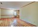 Spacious, sunny living room with hardwood floors, neutral paint, and ample natural light at 1417 Pine Island View, Mount Pleasant, SC 29464