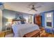 Charming main bedroom with a queen bed, wooden floors, and a view into the ensuite bathroom at 1417 Pine Island View, Mount Pleasant, SC 29464