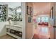 Stylish powder room with floral wallpaper and custom vanity at 1417 Pine Island View, Mount Pleasant, SC 29464