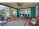 Relaxing screened porch with comfortable seating, creating an ideal outdoor living space at 1417 Pine Island View, Mount Pleasant, SC 29464