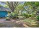 Landscaped yard featuring lush greenery and brick pathway, enhancing the property's curb appeal at 1417 Pine Island View, Mount Pleasant, SC 29464
