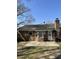 Back exterior view of a brick home with a patio at 142 Aylesbury Rd, Goose Creek, SC 29445