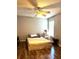 Bedroom features hardwood floors, ceiling fan, and natural light from a window at 142 Aylesbury Rd, Goose Creek, SC 29445