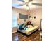 Bedroom with hardwood floors, modern ceiling fan, and natural light at 142 Aylesbury Rd, Goose Creek, SC 29445