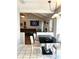 Bright dining area with black table, white chairs, and view into the cozy living room at 142 Aylesbury Rd, Goose Creek, SC 29445