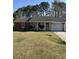 Single-story home with two car garage, set on a level lot at 142 Aylesbury Rd, Goose Creek, SC 29445