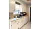This kitchen features white cabinets and a stainless steel sink with plenty of counter space at 142 Aylesbury Rd, Goose Creek, SC 29445