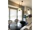 Bright kitchen with ample natural light, adjacent to a dining area with space for a table at 142 Aylesbury Rd, Goose Creek, SC 29445