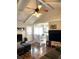 Inviting living room with fireplace, ceiling fan, and open layout to a bright dining area at 142 Aylesbury Rd, Goose Creek, SC 29445
