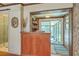 Bar area with wooden details and view of screened porch and a remodeled bathroom at 1421 Fairfield Ave, Charleston, SC 29407