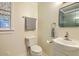Cozy half-bathroom featuring neutral tones, classic fixtures, and a stylish window treatment at 1421 Fairfield Ave, Charleston, SC 29407