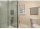 Modern bathroom with tiled shower, updated fixtures, and natural light from the window at 1421 Fairfield Ave, Charleston, SC 29407