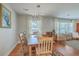 Warm dining room showcases hardwood floors, ample natural light, and seamless flow to living spaces at 1421 Fairfield Ave, Charleston, SC 29407