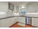 Updated kitchen featuring stainless steel appliances, modern backsplash and light countertops at 1421 Fairfield Ave, Charleston, SC 29407