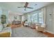 Bright living room featuring hardwood floors, a ceiling fan, and lots of natural light creating an inviting atmosphere at 1421 Fairfield Ave, Charleston, SC 29407