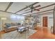 Comfortable living room with wooden ceiling beams, plush sofas, and built-in bookshelves at 1421 Fairfield Ave, Charleston, SC 29407