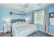 Serene main bedroom featuring light blue walls, a ceiling fan, and hardwood floors at 1421 Fairfield Ave, Charleston, SC 29407