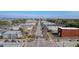 A scenic aerial view of a neighborhood with streets, commercial buildings, trees, and parked cars at 1450 E Montague Ave, North Charleston, SC 29405