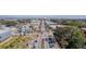 An aerial view of a quaint neighborhood showcasing streets, trees, commercial buildings, and parked cars at 1450 E Montague Ave, North Charleston, SC 29405