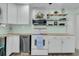 Bright kitchen features stainless steel appliances, butcher block countertops, and decorative open shelving at 1450 E Montague Ave, North Charleston, SC 29405